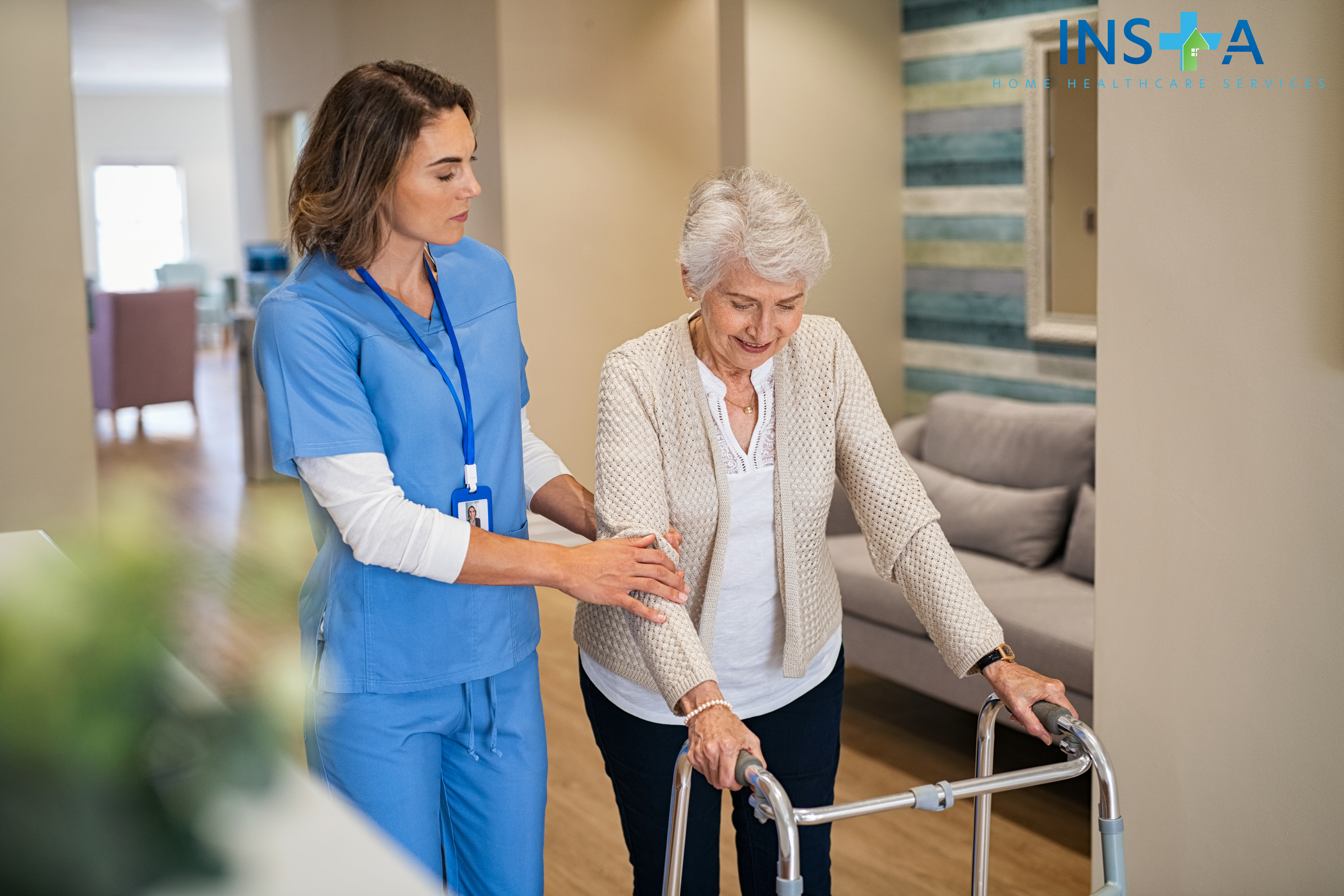 Lovely nurse helping old woman to walk at nursing home with walker. Young nurse helping senior patient using a walking frame to walk in hospital corridor. Caregiver and disabled lady in care facility.